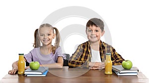 Happy children with healthy food for school lunch at desk