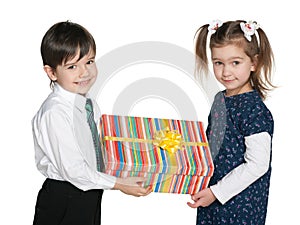 Happy children hold a gift box