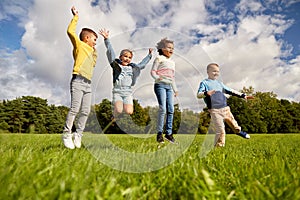 happy children jumping at park