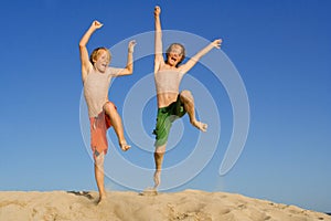 Happy children or kids jumping