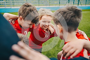 Happy children making sport. Group of happy boys making sports huddle