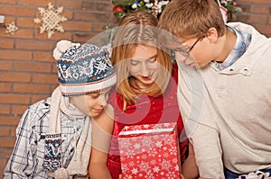 Happy Children Opening Gifts. New Year.