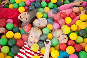 Happy children playing in ball pool