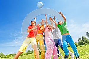 Happy children playing and catching ball