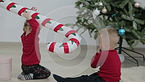 Happy children playing with christmas gift