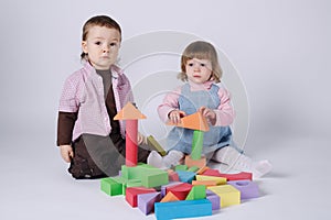 Happy children playing with cubes