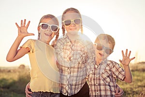 Happy children playing on the field at the day time.