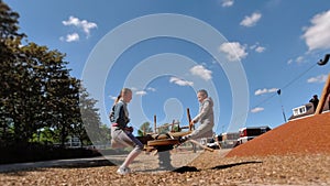 Happy children playing and having fun at playground. Cute children having fun on a play ground 