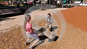 Happy children playing and having fun at playground. Cute children having fun on a play ground 