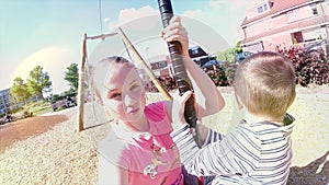 Happy children playing and having fun at playground. Cute children having fun on a play ground 