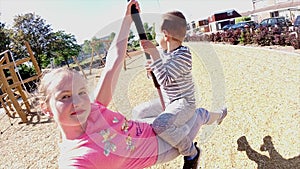 Happy children playing and having fun at playground. Cute children having fun on a play ground 