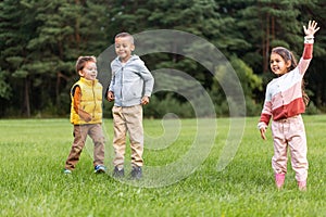 happy children playing and jumping at park