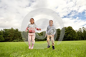 happy children playing and jumping at park