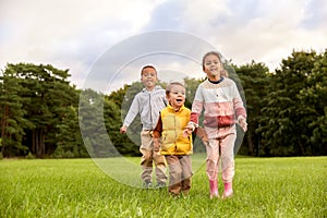 happy children playing and jumping at park