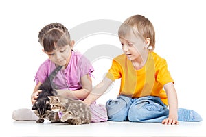 Happy children playing with kitten