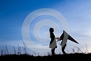 Happy children playing on nature summer silhouette