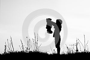 Happy children playing on nature summer silhouette