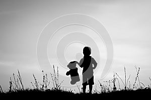 Happy children playing on nature summer silhouette