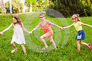 Happy children playing outdoors on a camping holiday