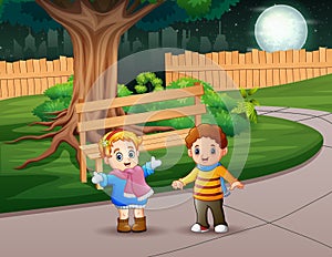 Happy children playing outside at night