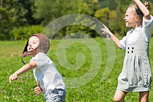 Happy children playing in the paper plane