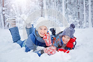 Happy children playing on snowy winter day.