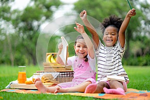 Happy children playing in summer park on warm sunny fall day. Healthy lifestyles concept