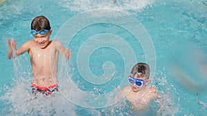 Happy children pool fun splash water happy summer kids splashing in pool kids holiday summer travel fun boy. Cheerful