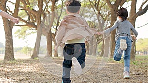 Happy children running in race outdoors at school