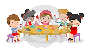 Happy children`s activity in the kindergarten, cute kids with playing toy, Group of happy school child in classroom, education