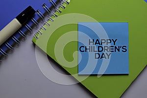 Happy Children`s Day write on sticky notes. Isolated on white table background