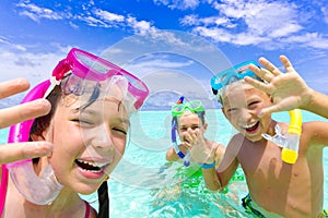 Happy children snorkeling