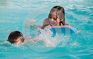 Happy Children Splashing In Pool