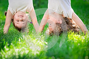 Happy children standing upside down