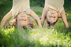 Happy children standing upside down