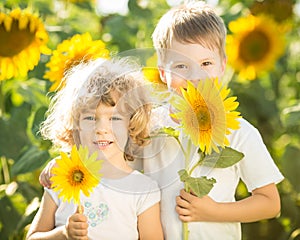 Happy children with sunflower