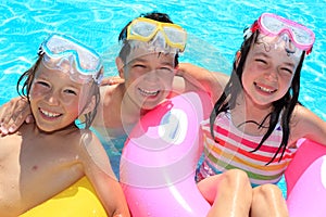 Happy children in swimming pool