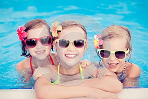 Happy children in the swimming pool