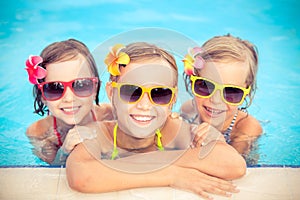 Happy children in the swimming pool