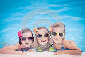 Happy children in the swimming pool