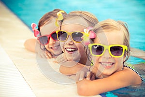 Happy children in the swimming pool