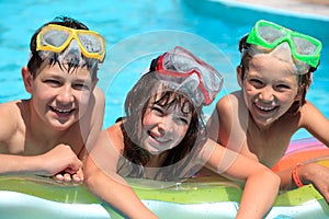 Happy children in swimming pool