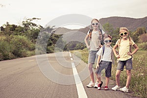 Happy children  walking on the road at the day time