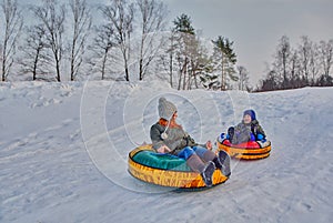 Happy children on a winter sleigh ride