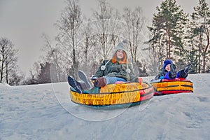 Happy children on a winter sleigh ride