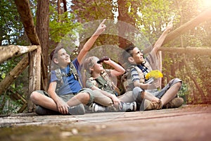 Happy childs in green forest playing,concept of kids vacations a