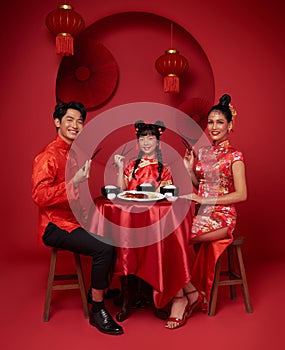 Happy Chinese new year. Asian family dinner food for prosperity celebration festival isolated on red decoration traditional