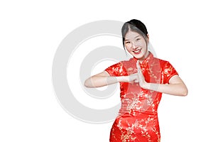 Happy Chinese new year. Asian woman wearing traditional cheongsam qipao dress with gesture of congratulation isolated on white