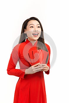 Happy chinese new year and Lunar new year, Attractive Asian woman dress traditional ao dai holding red envelopes or ang pow or red