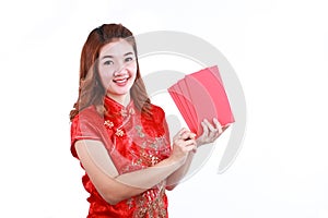 Happy chinese new year. smiling asian woman holding red envelope